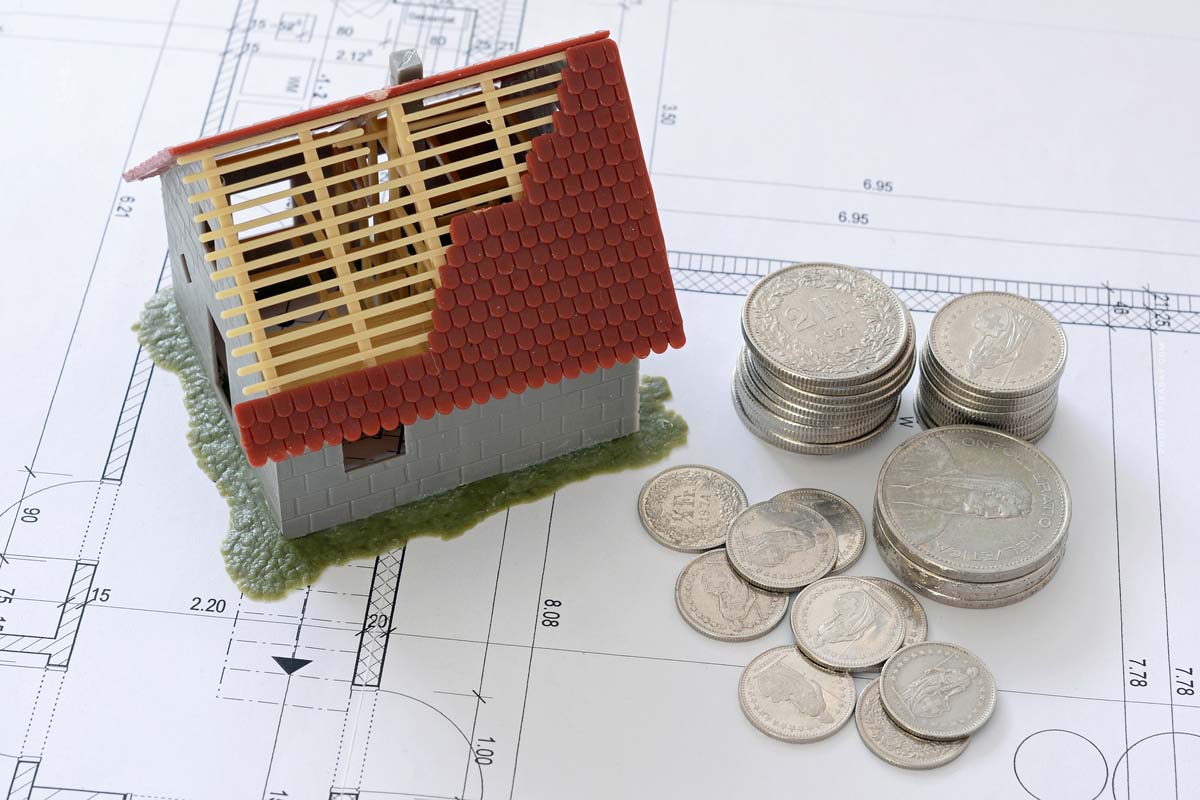 finanzierung-geld-haus-bauen-bank-immobilie-bauplan-kaufpreis